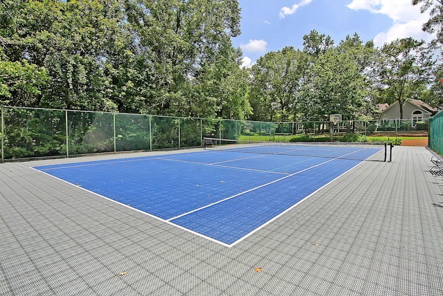 view of sport court with basketball hoop