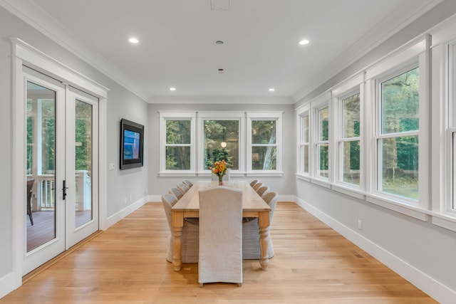 dining room featuring plenty of natural light, light hardwood / wood-style floors, and french doors