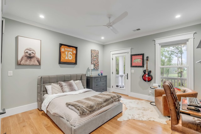 bedroom featuring access to outside, ceiling fan, multiple windows, and light hardwood / wood-style flooring