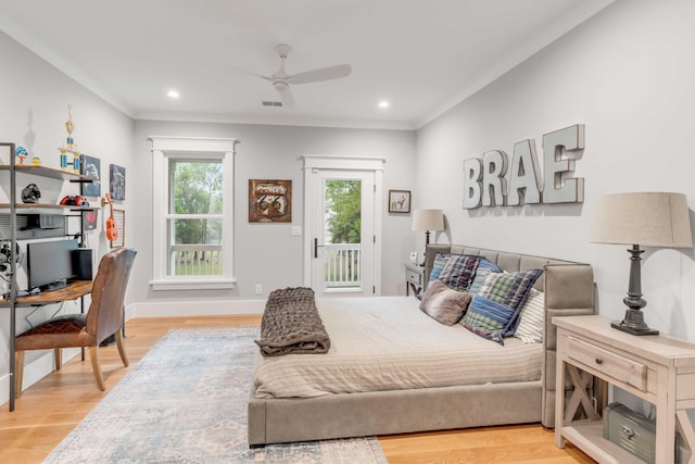 bedroom featuring ceiling fan, light hardwood / wood-style floors, and access to exterior