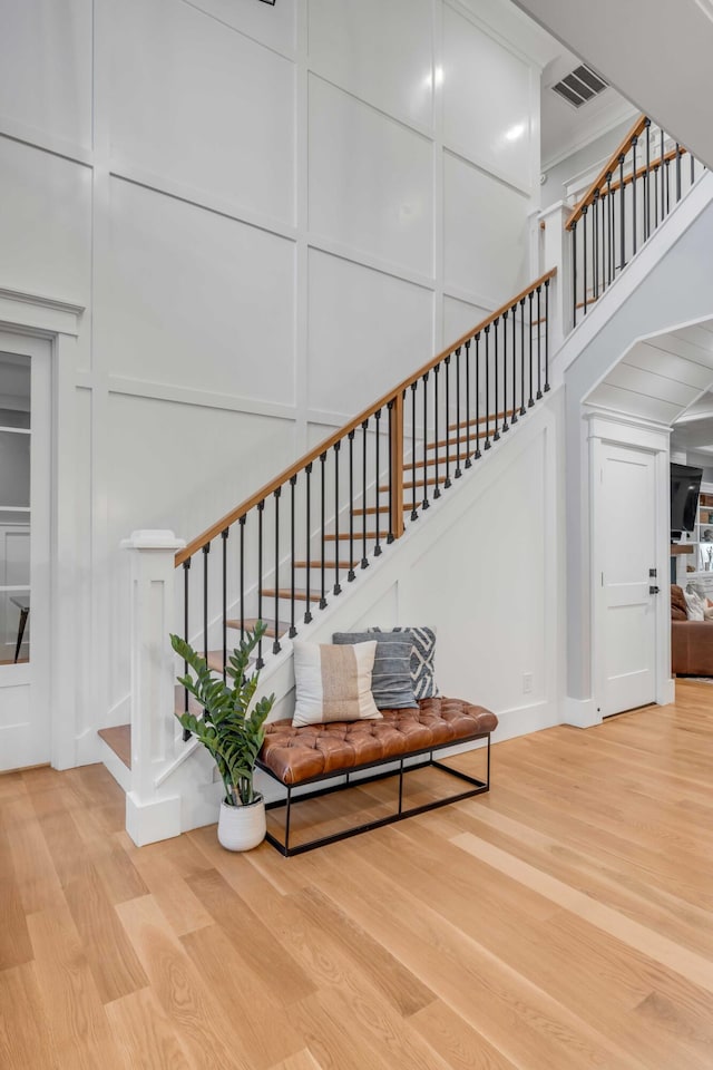 stairway featuring light wood-type flooring