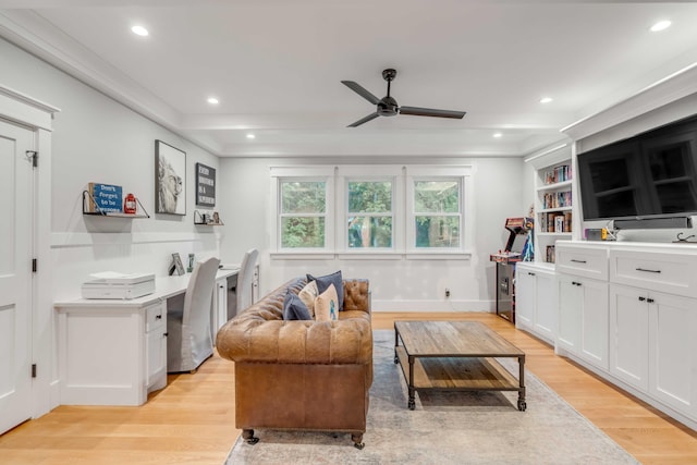 living room with ceiling fan and light hardwood / wood-style flooring