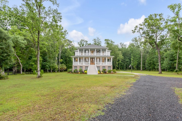 view of front of house featuring a front lawn and covered porch