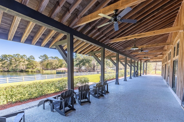 view of property's community with a patio area and a water view