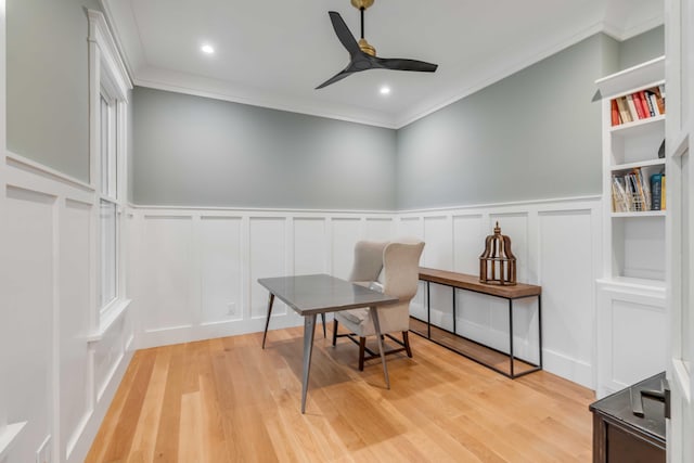 office with light hardwood / wood-style floors, ornamental molding, and ceiling fan