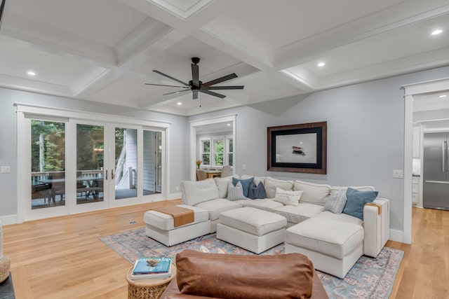 living room featuring coffered ceiling, ceiling fan, and light wood-type flooring