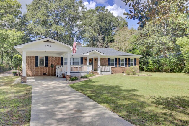 ranch-style house with a front lawn and a porch