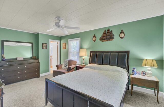 recreation room with a textured ceiling, carpet, ornamental molding, and ceiling fan