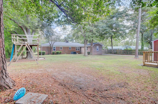 view of yard featuring a playground and cooling unit