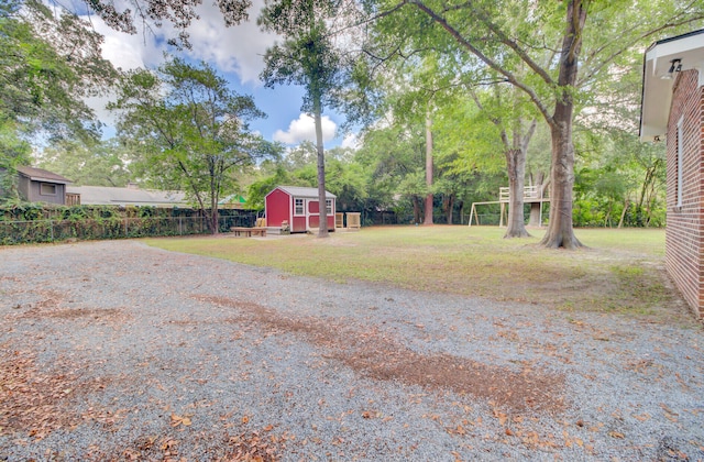 view of yard with a storage unit