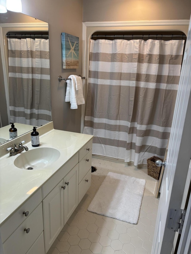 full bathroom with tile patterned flooring, vanity, and a shower with curtain