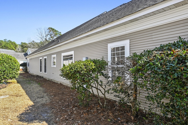 view of home's exterior featuring a shingled roof