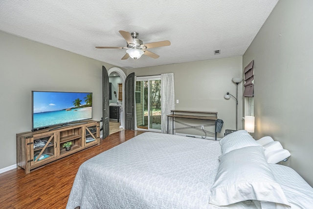 2650 Summer Leaves Ct, Charleston, SC 29414 - bedroom featuring access to exterior, wood finished floors, a textured ceiling, arched walkways, and ceiling fan