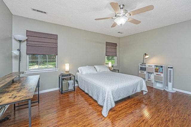 2650 Summer Leaves Ct, Charleston, SC 29414 - bedroom featuring wood finished floors, baseboards, ceiling fan, and a textured ceiling