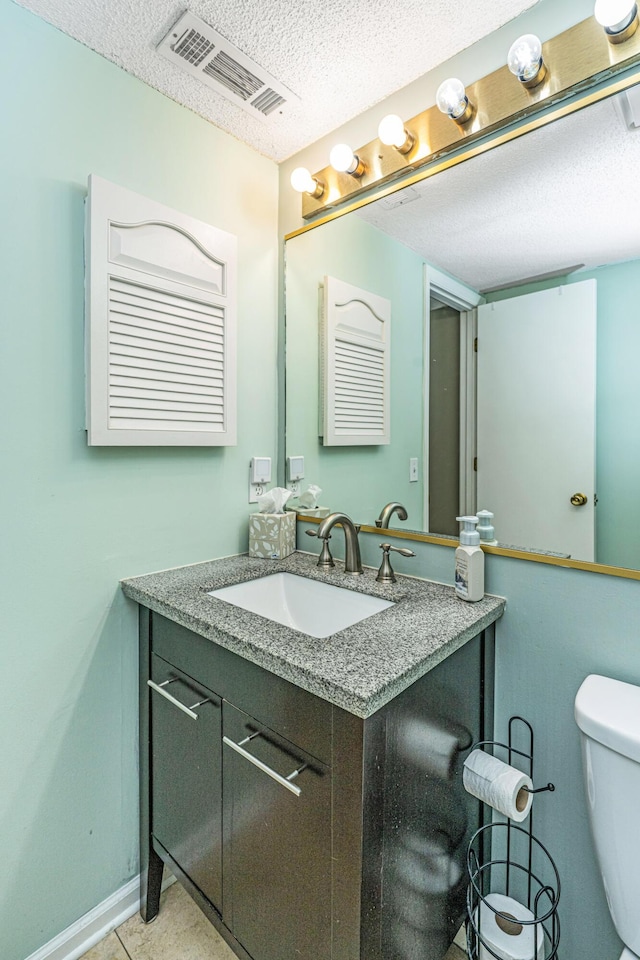 2650 Summer Leaves Ct, Charleston, SC 29414 - half bathroom with vanity, a textured ceiling, toilet, and baseboards