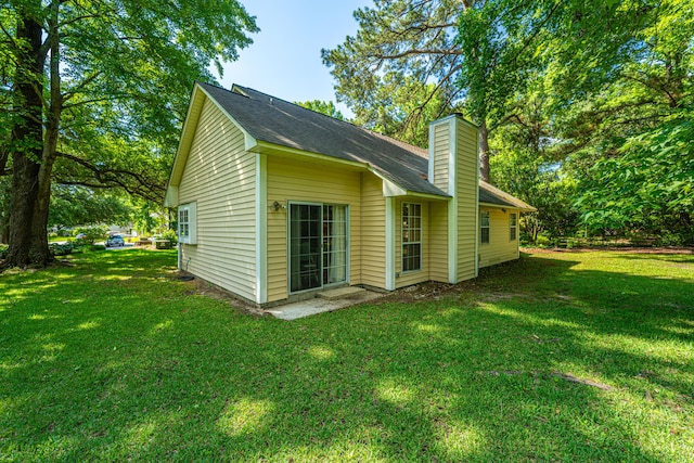 2650 Summer Leaves Ct, Charleston, SC 29414 - back of house featuring a chimney, a lawn, and roof with shingles