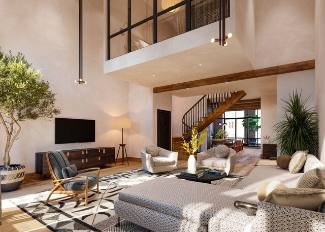 71 Wentworth Street Units 202,203,204,206,301, Charleston, SC 29401 - living room with a towering ceiling, stairway, and wood finished floors