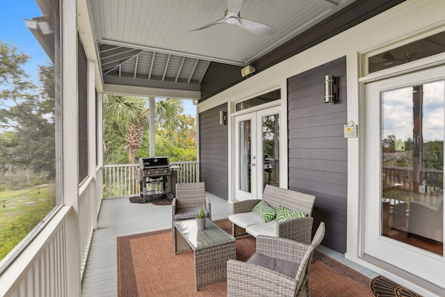 sunroom with ceiling fan and plenty of natural light