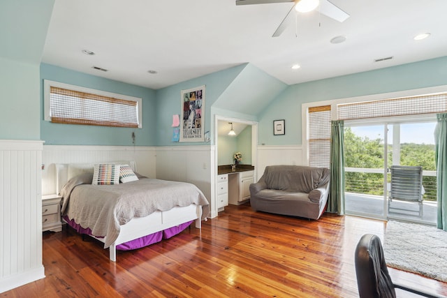 bedroom with access to exterior, hardwood / wood-style flooring, and ceiling fan