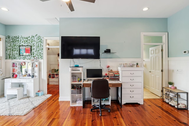 office with hardwood / wood-style floors and ceiling fan