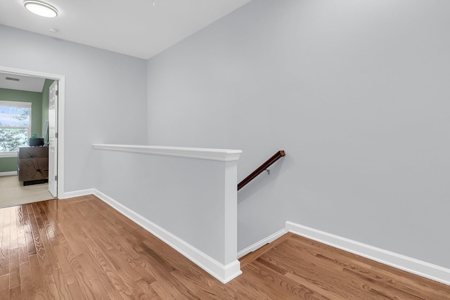 hall with light hardwood / wood-style flooring