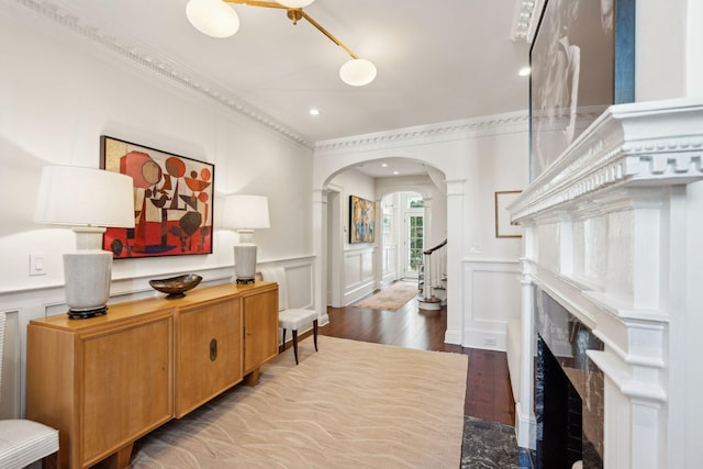 interior space featuring hardwood / wood-style flooring and crown molding