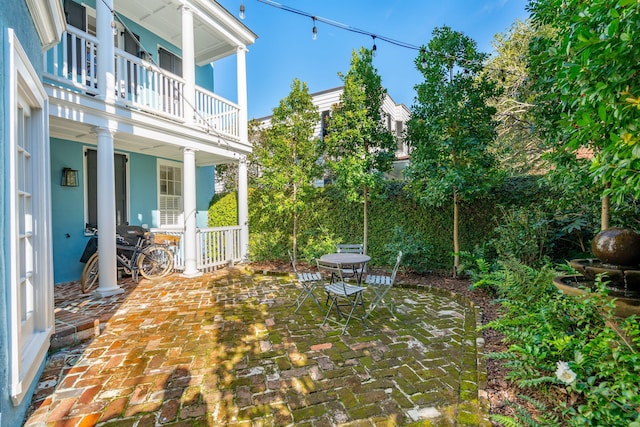 view of patio with a balcony