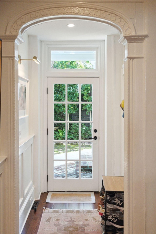 doorway with dark hardwood / wood-style flooring