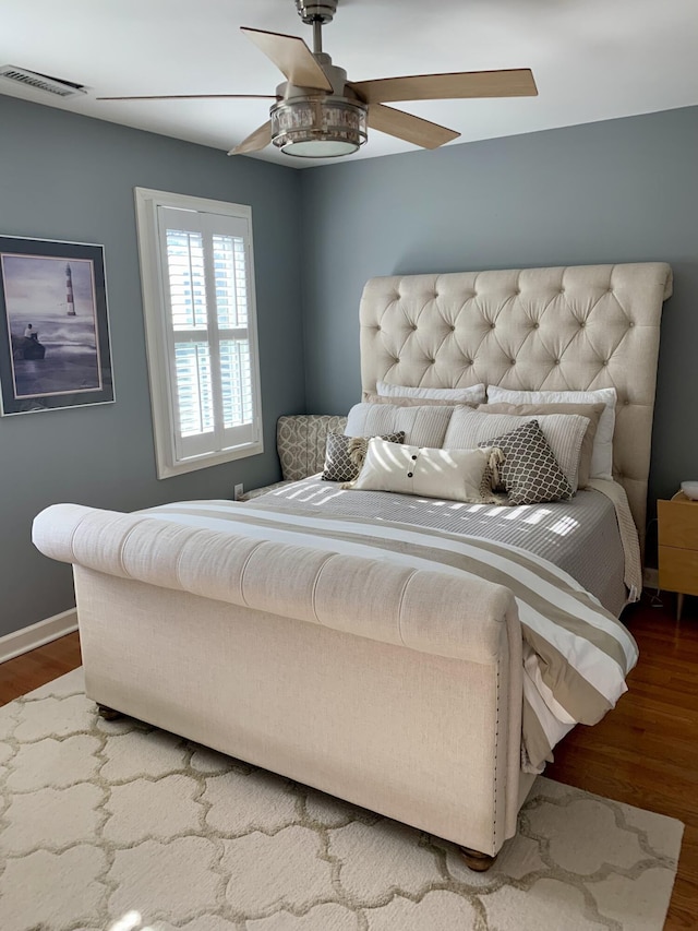 bedroom featuring ceiling fan and hardwood / wood-style floors