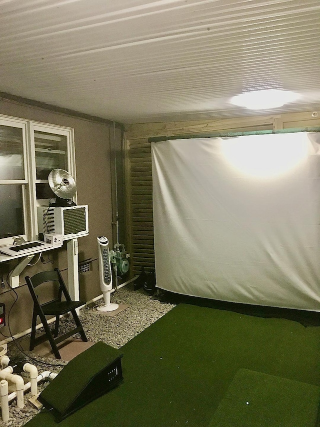 recreation room with golf simulator and cooling unit