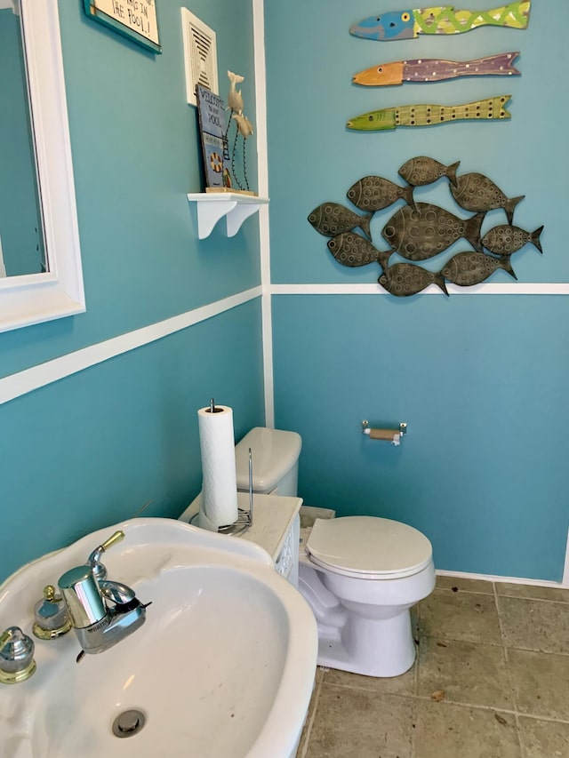 bathroom with sink and toilet