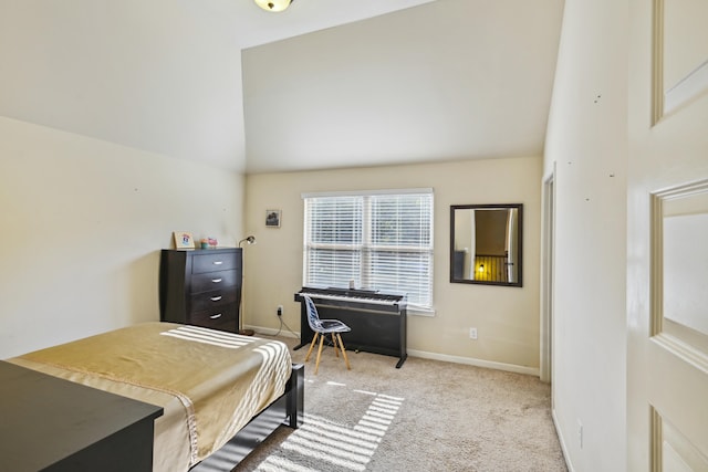 bedroom with light carpet and high vaulted ceiling