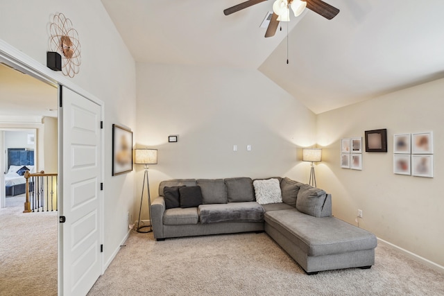 living room with light colored carpet, ceiling fan, and lofted ceiling