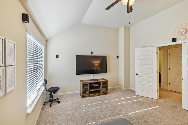 living room with plenty of natural light, vaulted ceiling, light colored carpet, and ceiling fan