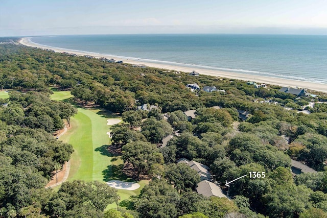 birds eye view of property featuring a water view and a beach view