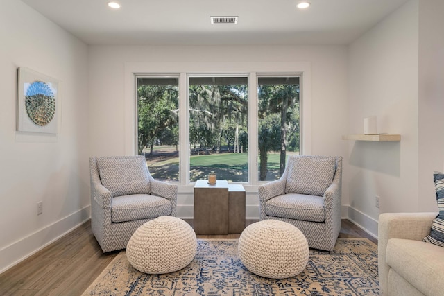 sitting room with visible vents, recessed lighting, baseboards, and wood finished floors