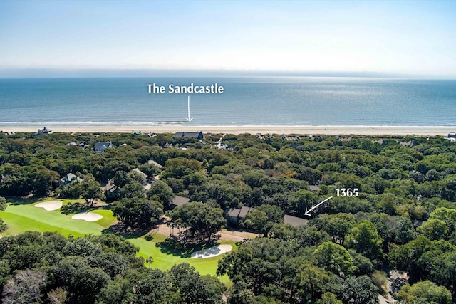 birds eye view of property with a beach view, view of golf course, and a water view