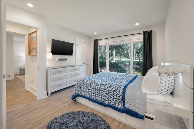 bedroom with recessed lighting, light wood-style flooring, and baseboards