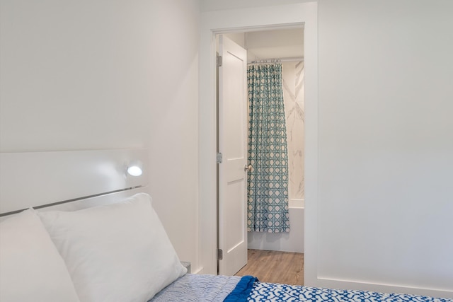 bedroom with wood finished floors