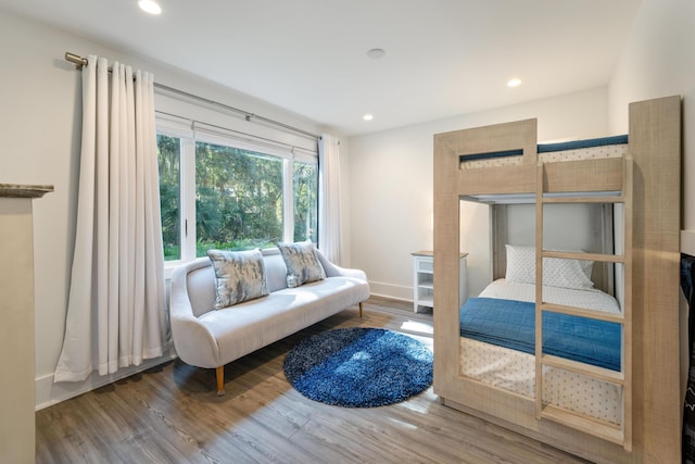 bedroom with baseboards, recessed lighting, and wood finished floors