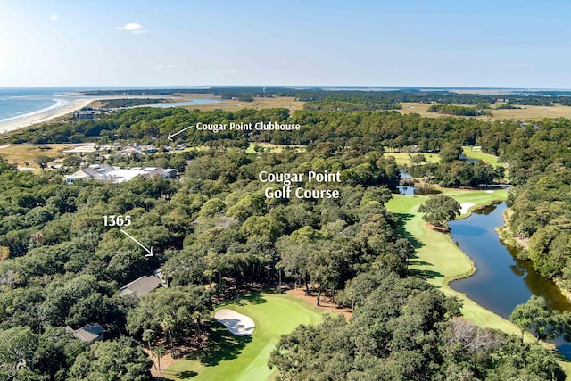 drone / aerial view with a water view and golf course view
