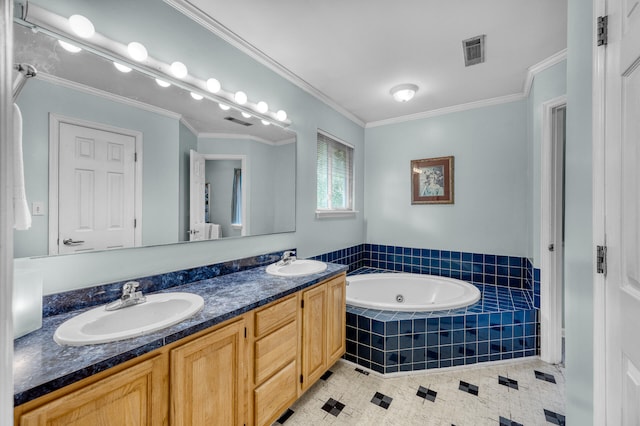 bathroom with vanity, tile patterned floors, crown molding, and tiled tub