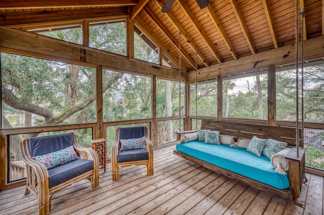 sunroom featuring vaulted ceiling with beams and wooden ceiling