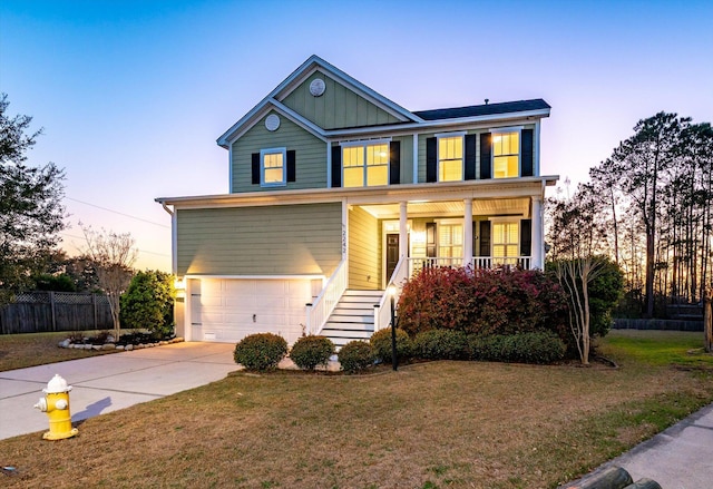 view of front of house with fence, a yard, covered porch, concrete driveway, and an attached garage