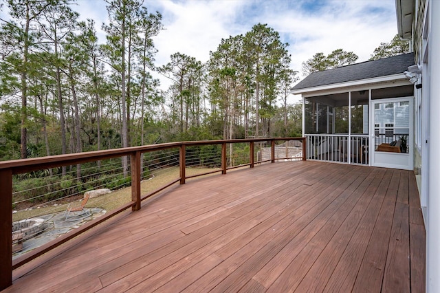 wooden deck featuring a sunroom