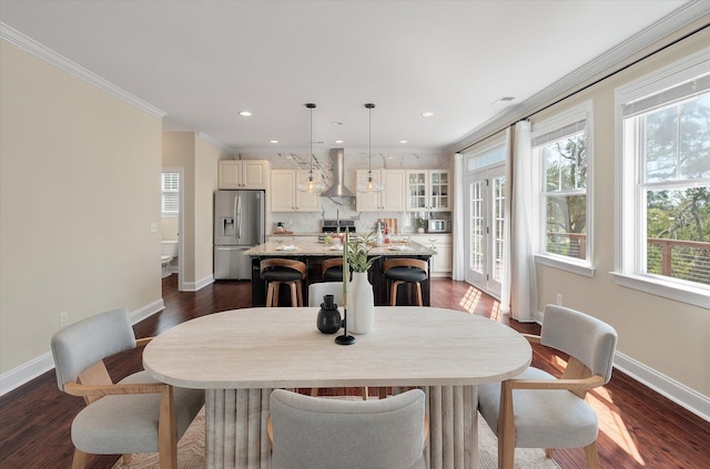 dining room featuring recessed lighting, crown molding, baseboards, and dark wood-style flooring