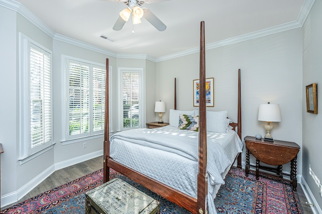 bedroom with ornamental molding, hardwood / wood-style floors, and ceiling fan