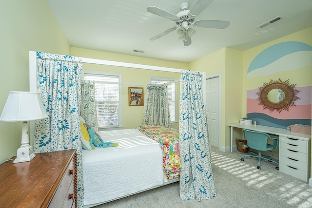 carpeted bedroom with ceiling fan