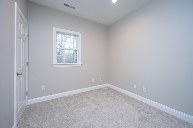 empty room featuring light colored carpet