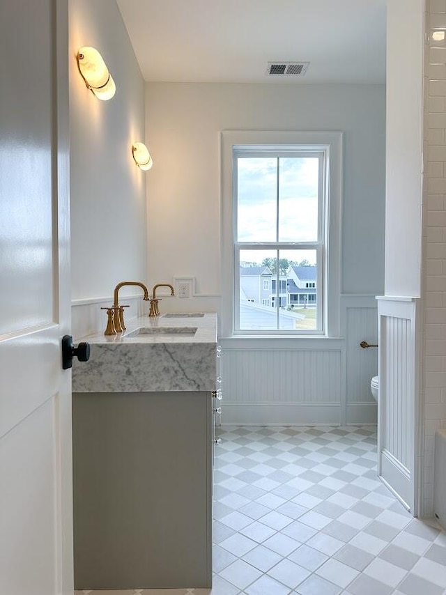 bathroom with vanity and toilet